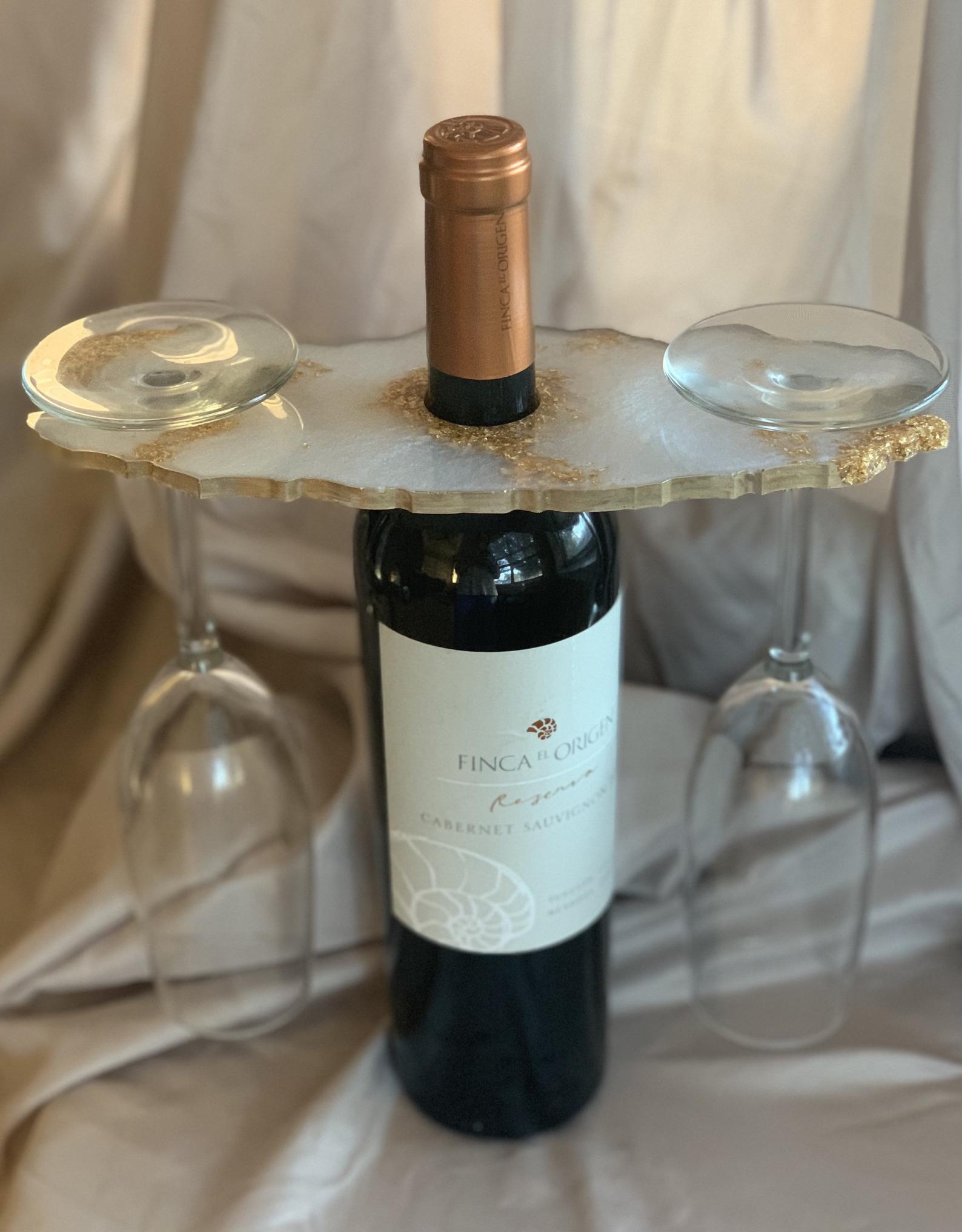 wine bottle with a butler tray holding two wine glasses