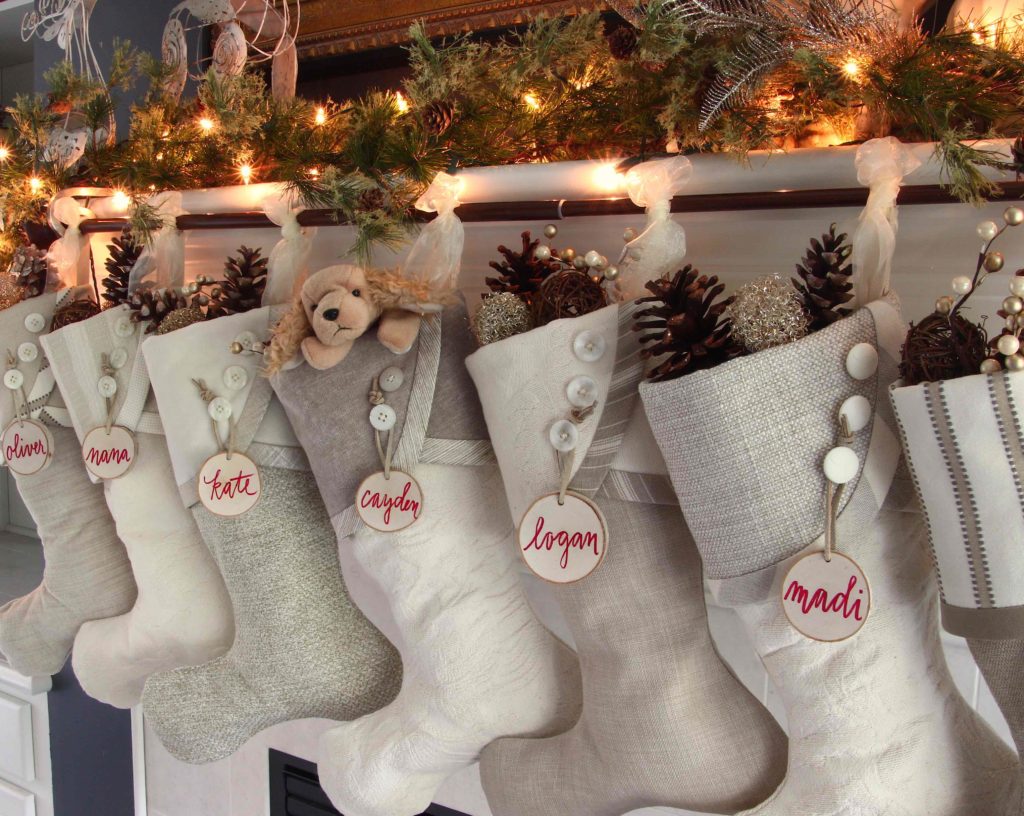 Eggnog and cream Christmas stockings with white birch tree slice name tags