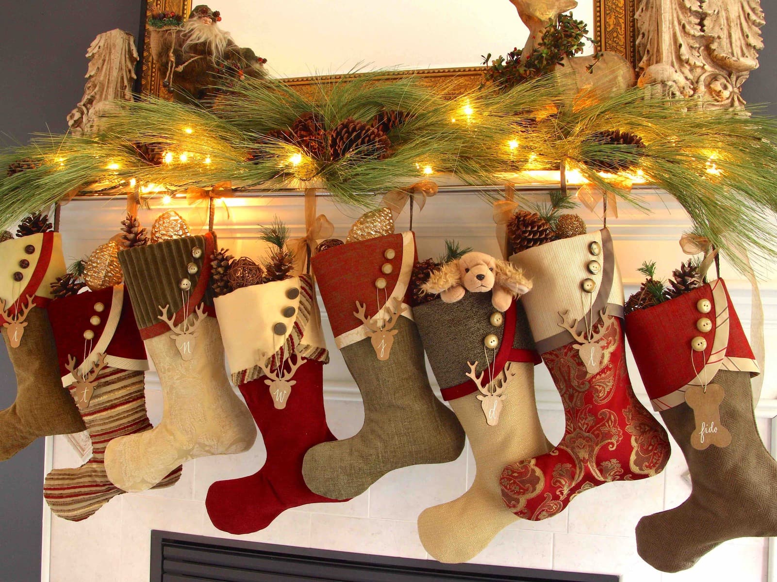 8 Christmas stockings hanging at staggered heights from stocking rod
