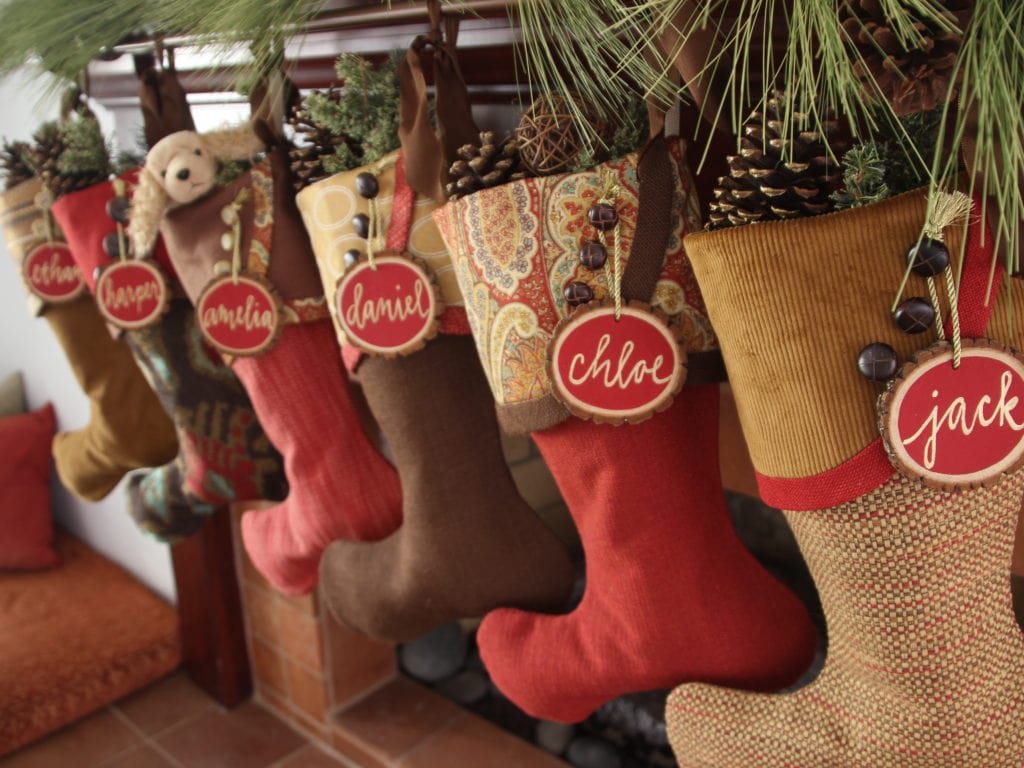 Cinnamon Apple Christmas Stockings with Red Tree Slice Name Tags