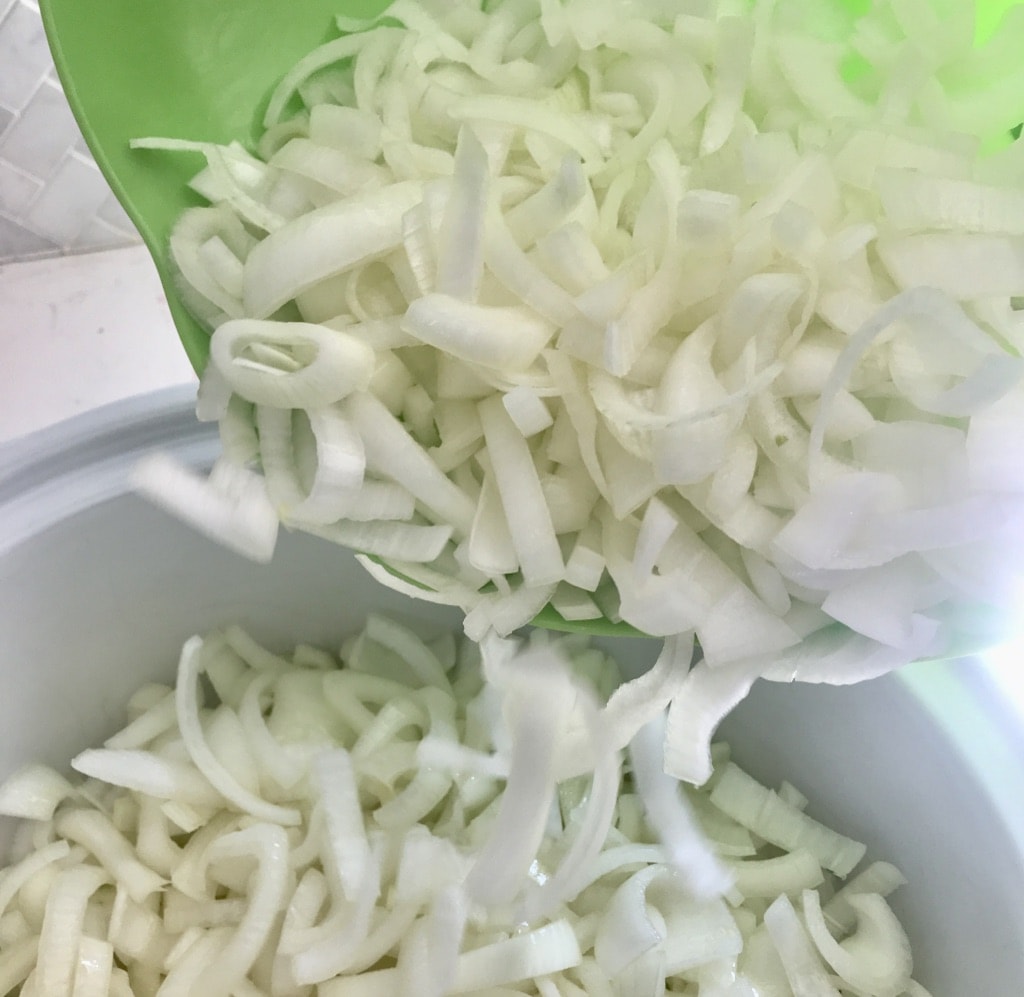 combine the bowl of onions in with the crock full of onions.