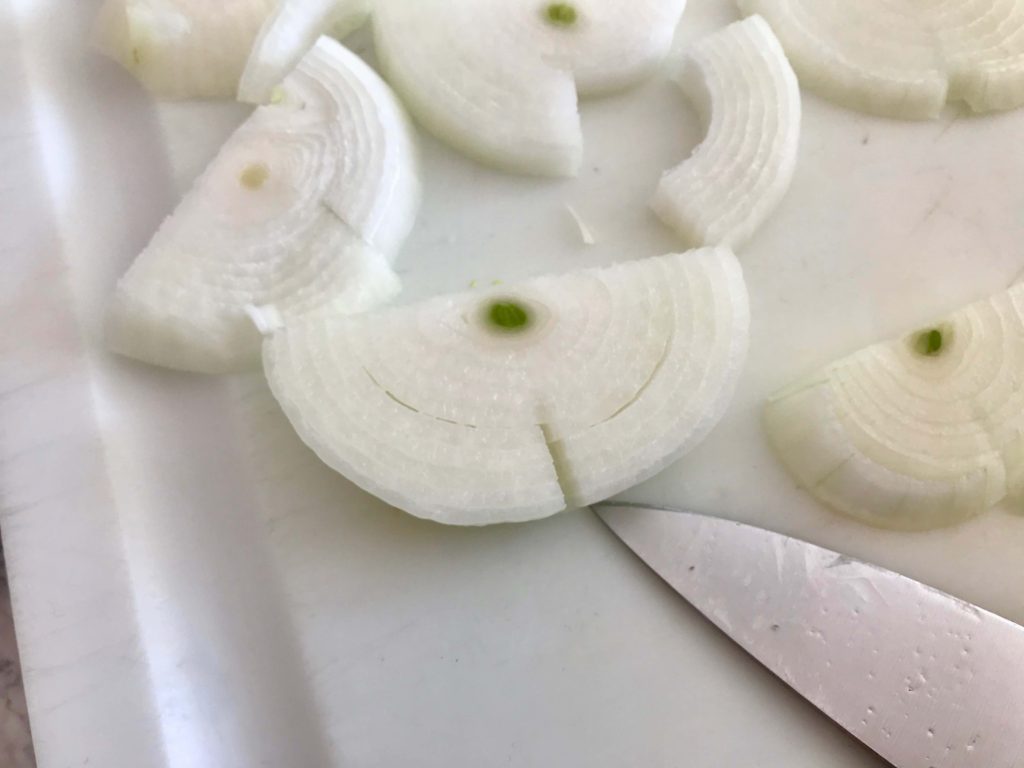 Cut through the outer rings of your slices to make your onions all of a more common size
