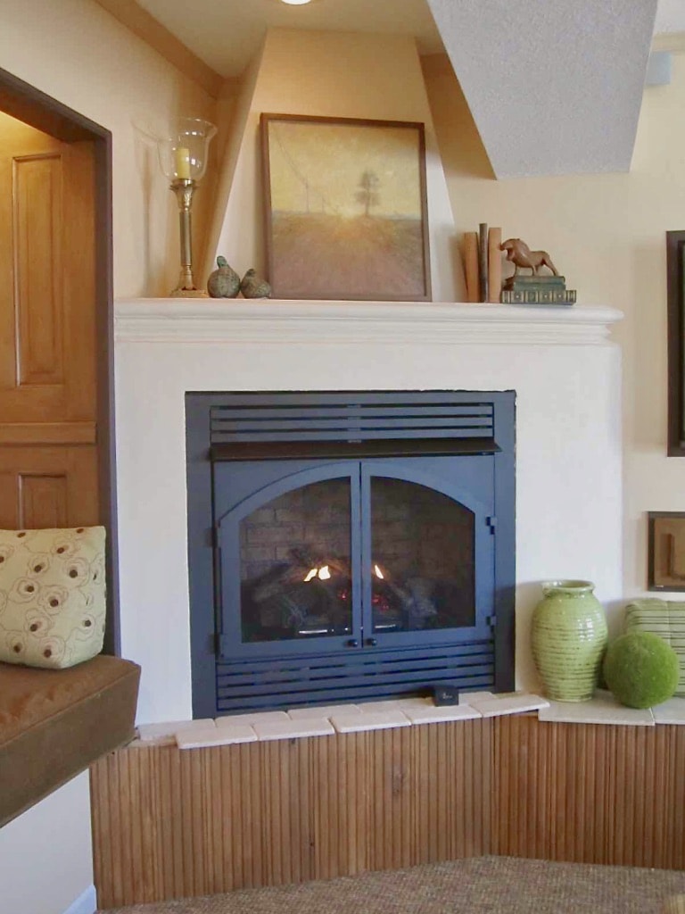 Finished faux concrete fireplace surround, mantel and tapered flue.