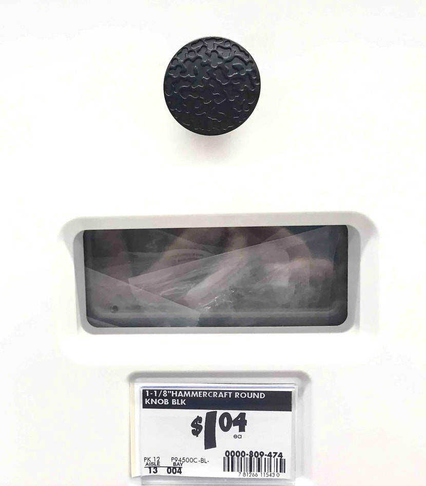 black drawer pull or knob and sku information from Home Depot