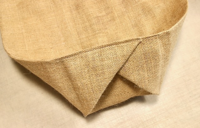 the end of the window box liner is shown with the triangles stitched in place like an envelope