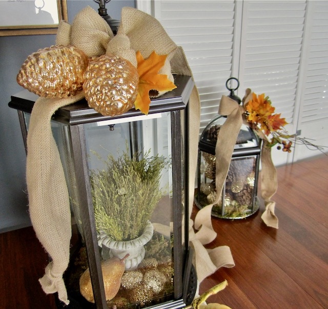 Lanterns for Fall with burlap, pinecones and leaves
