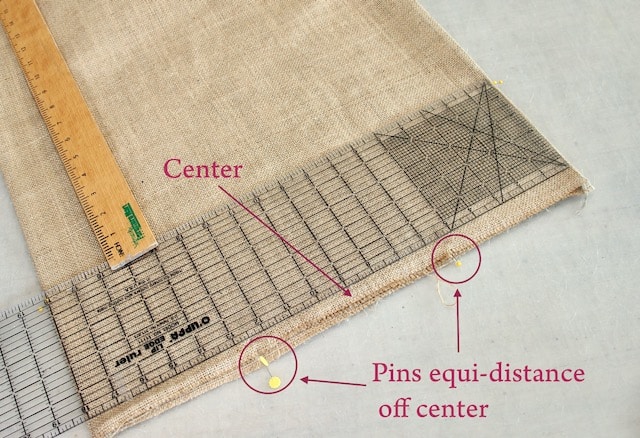 measurements marked on a piece of folded burlap