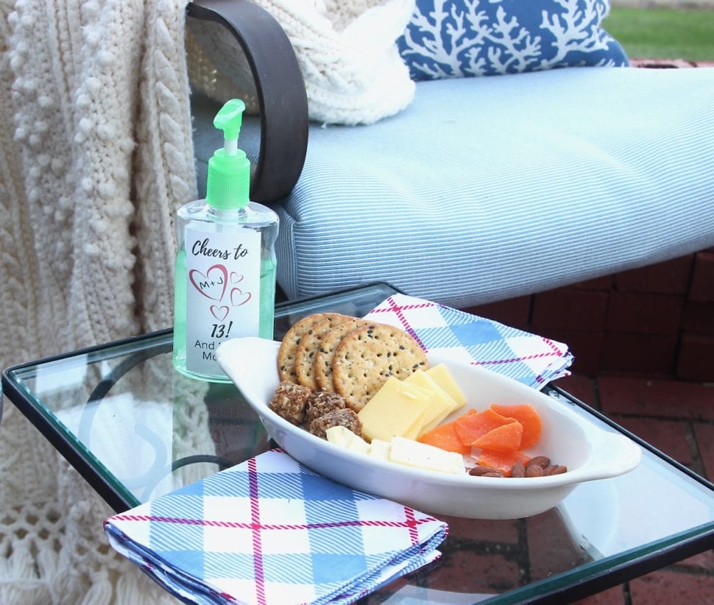 closeup of individual snack tray and hand sanitizer for safe get together