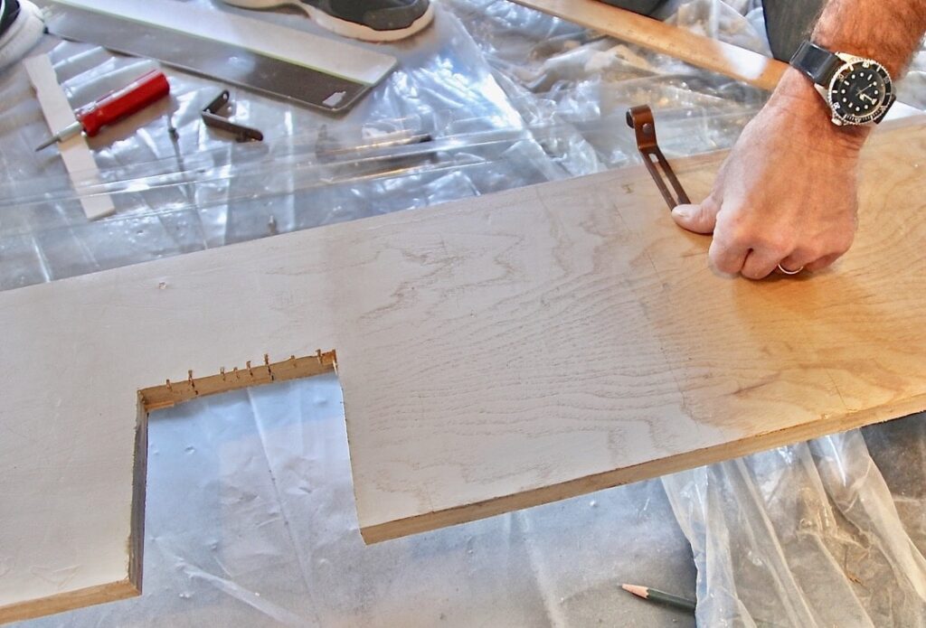 raw wood shelf being cut