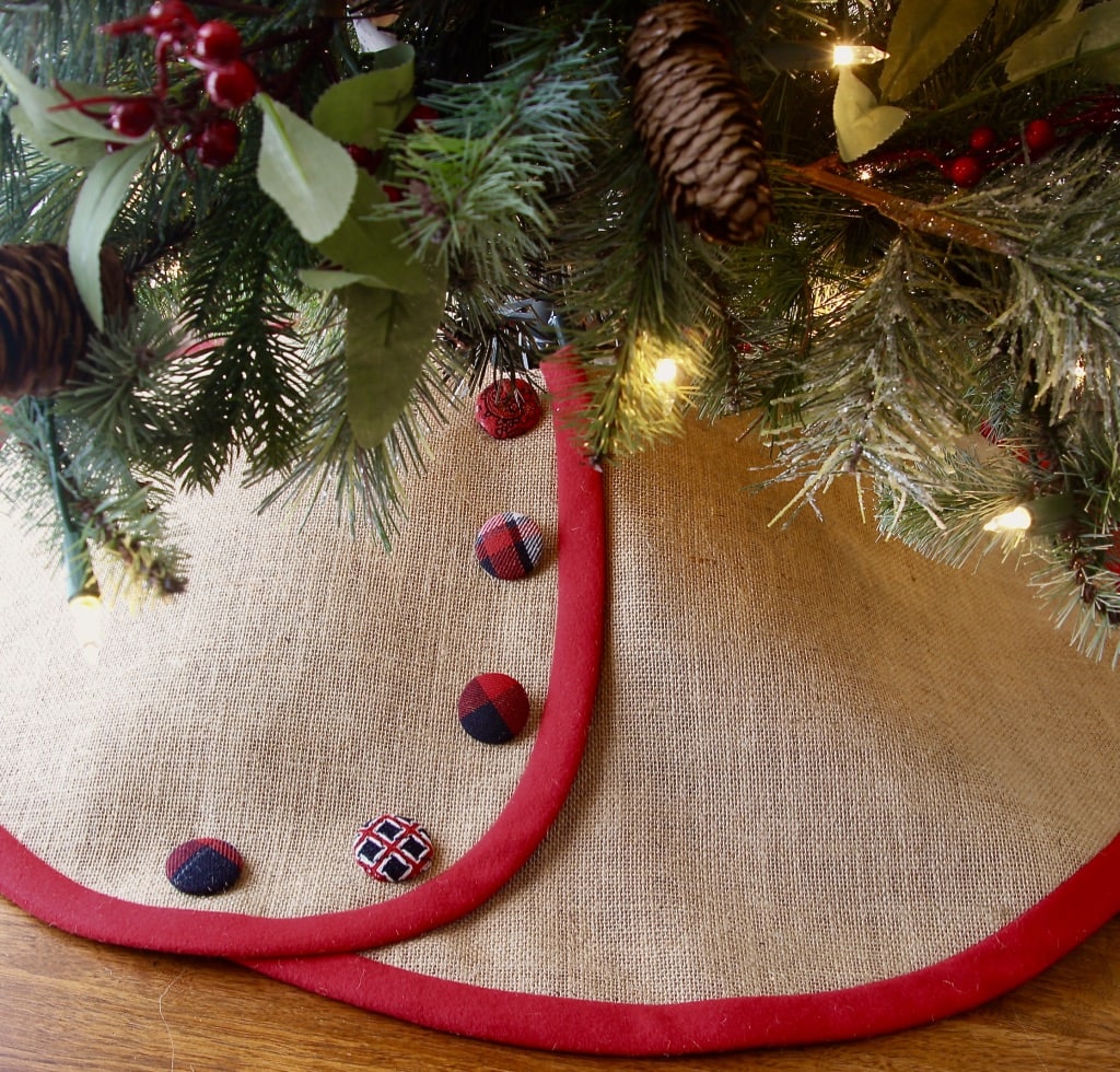 Small Burlap tree skirt is shown with red trim and red, white and black buttons