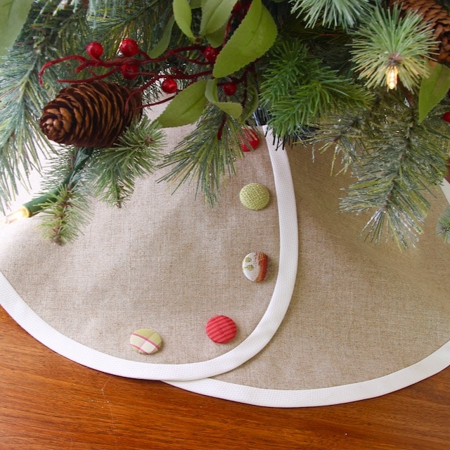 Pencil Linen Tree Skirt Banded with Creamy White with Bright Red & Green Buttons