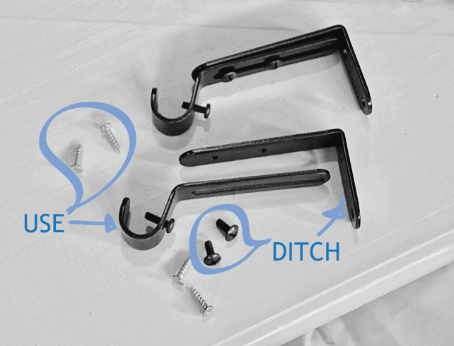pieces of curtain rod holder on the white shelf with parts marked as use or "ditch"