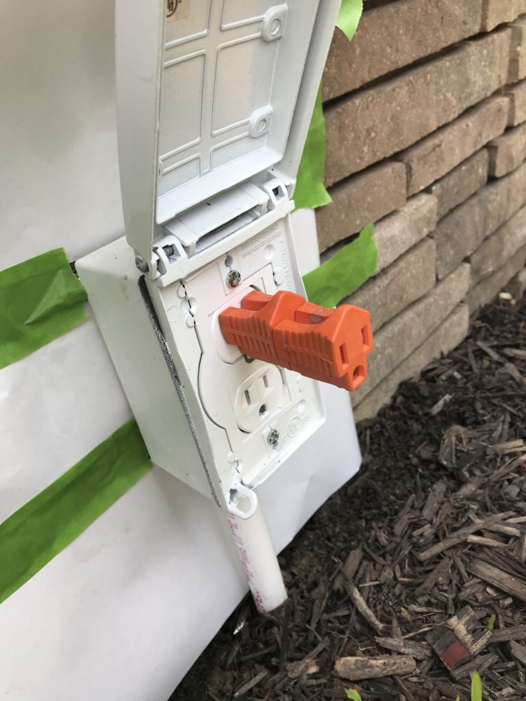 Two 3-prong converters in the box to prop the door open for the paint and primer to cure.