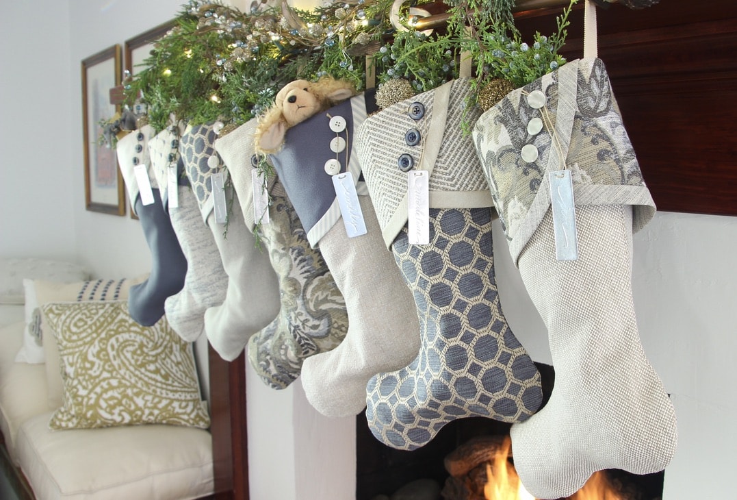 Angle view of seven Starry Night stockings hanging with aluminum name tags