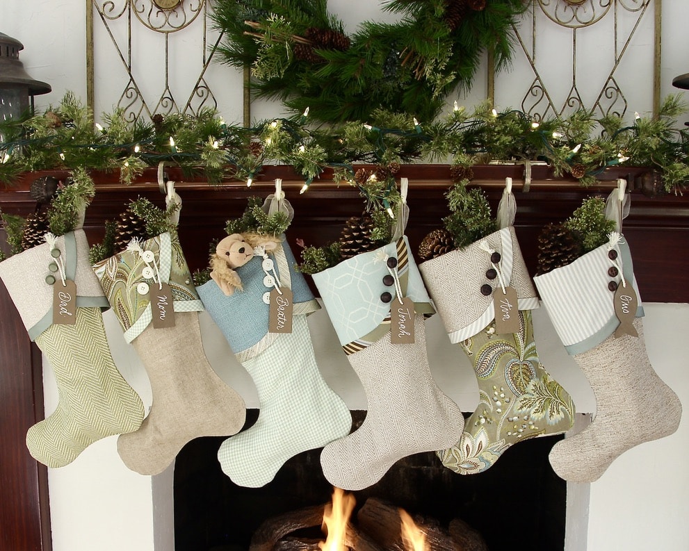 six coastal cottage Christmas stockings with bronze wood name tags