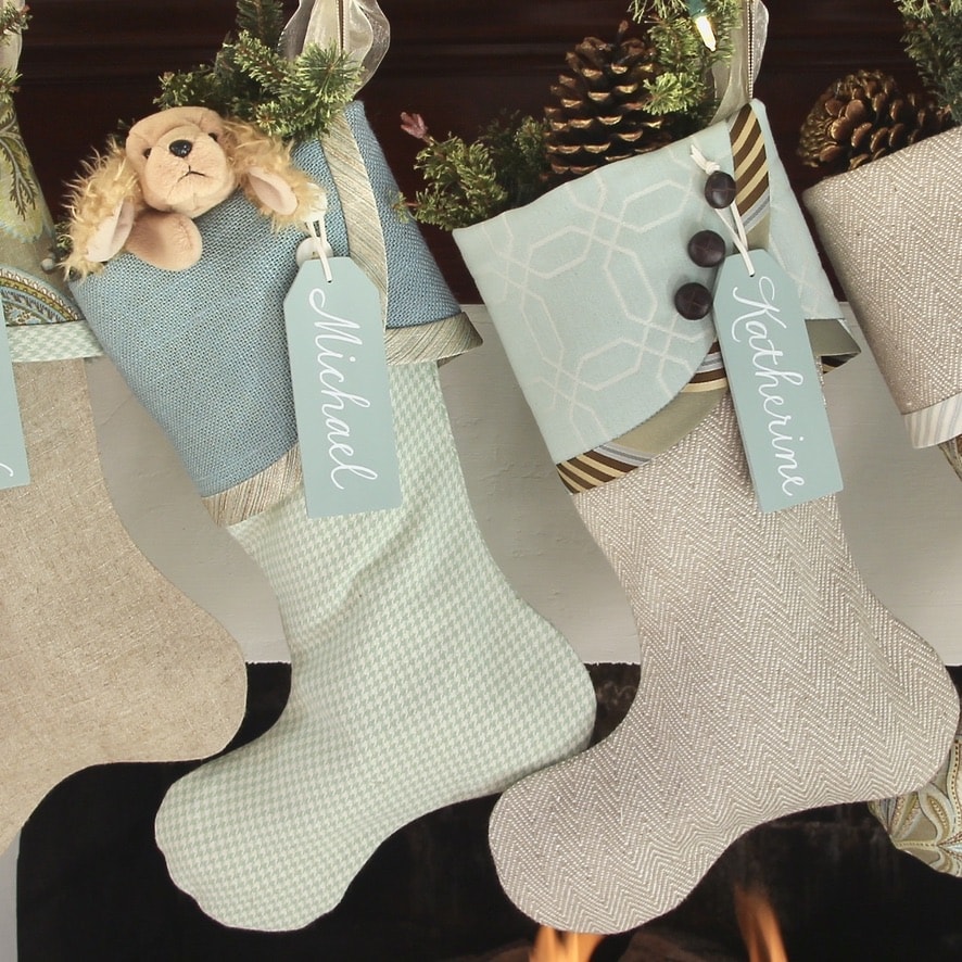 Two Coastal Cottage Christmas Stockings with blue name tags
