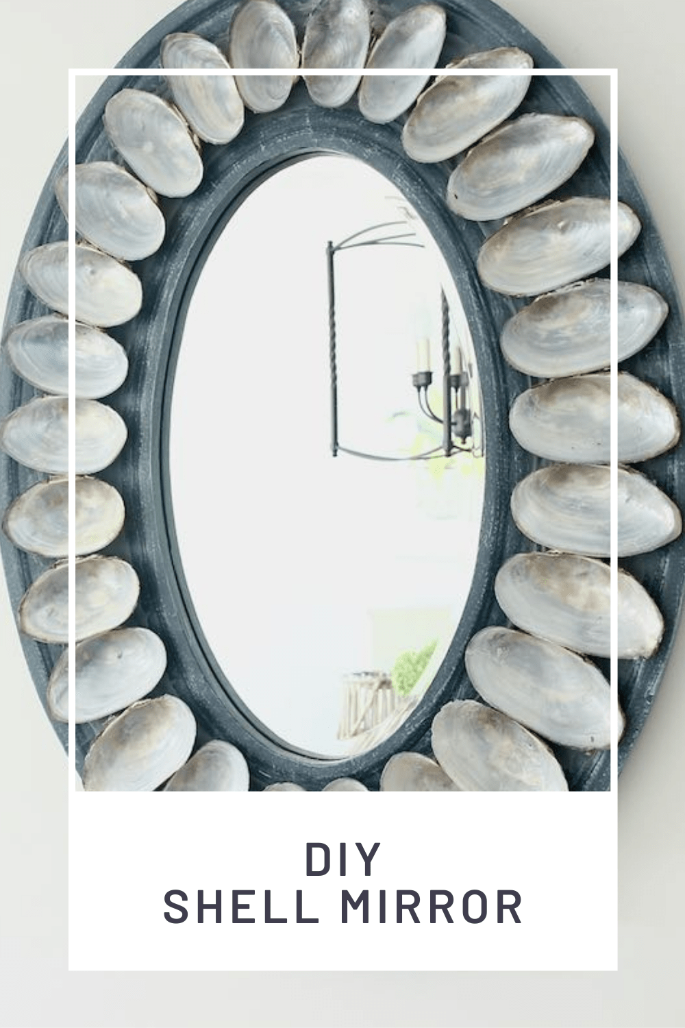 Shell Mirror hanging on white wall with title:"DIY SHELL MIRROR"