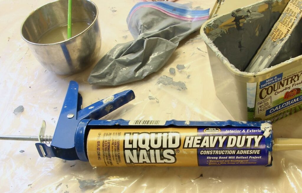 tube of "Liquid Nails" construction adhesive in a caulking gun