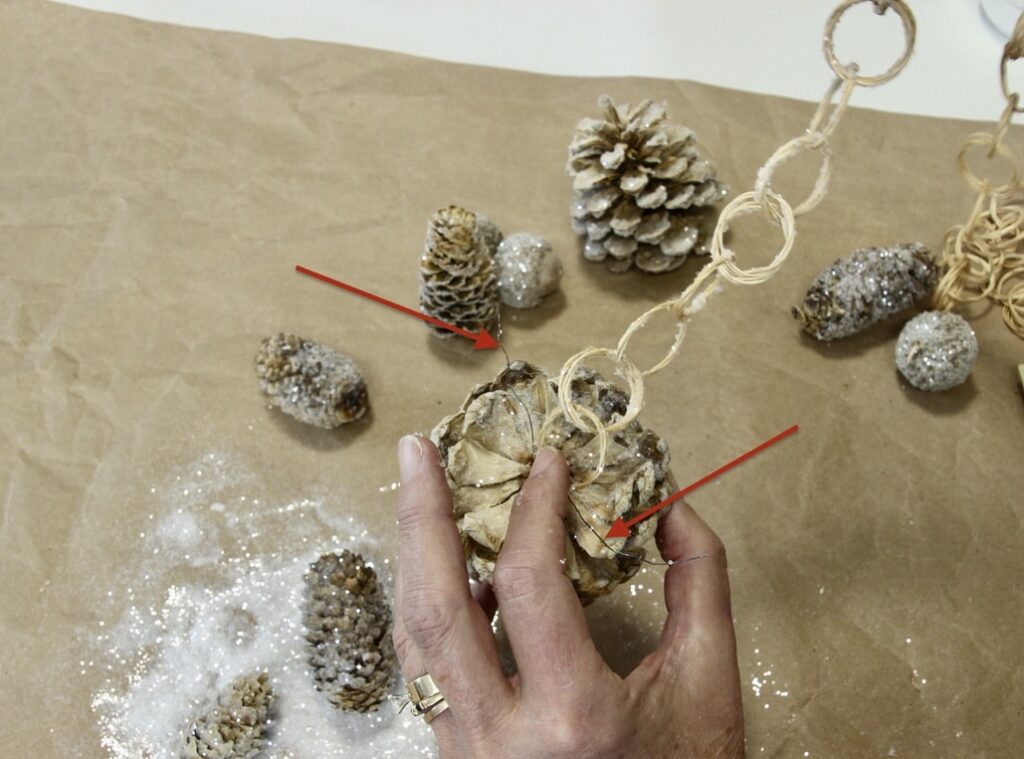 Attaching ring to pinecone with wire ends