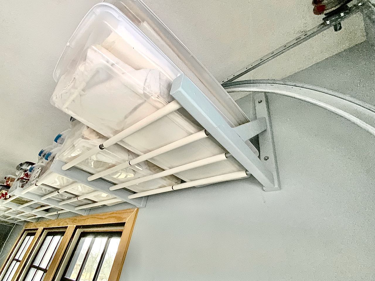 Above overhead garage door storage-Need ideas