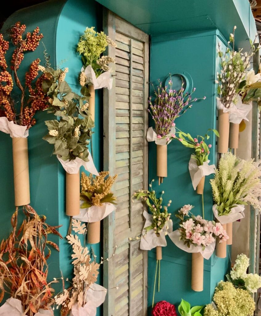 Turquoise HVAC with vintage shutters and floral stems