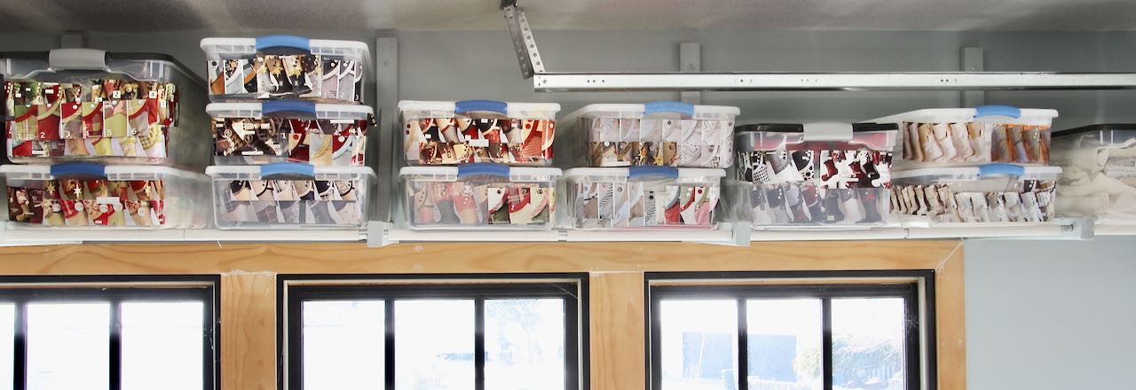 wide view of view from the overhead garage storage filled with plastic tubs