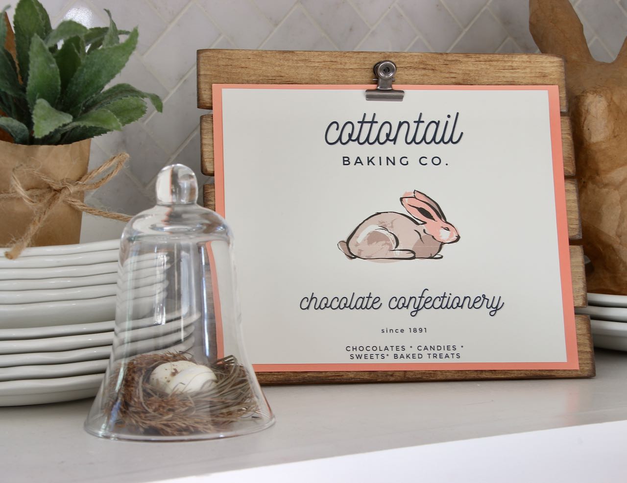 Cottontail Baking Company with Bunny logo on stained easel