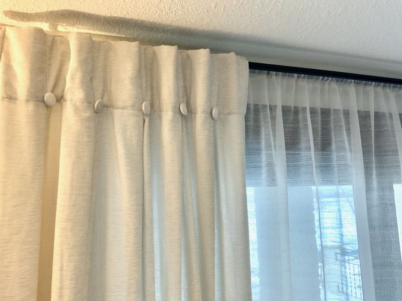 Stationary Curtain Panel on a rod with sheer curtains on a rod behind up very close to the ceiling