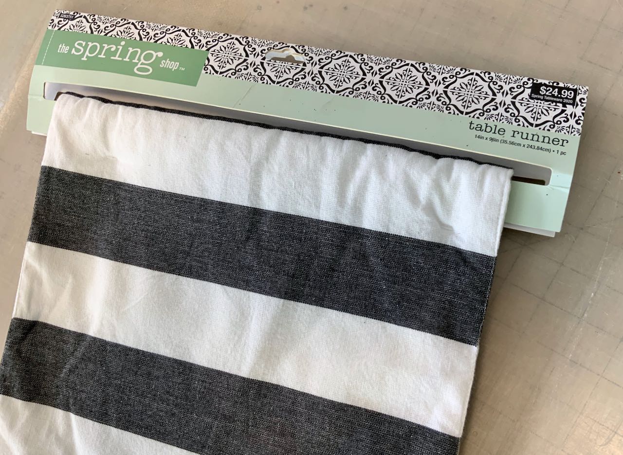 Stripe table runner on hanger from Hobby Lobby with price tag of $24.99