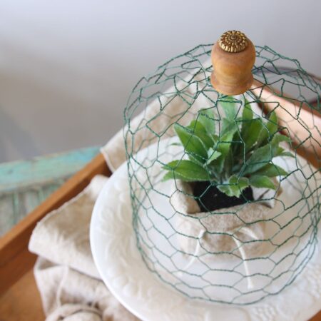 Closeup of Finished Wire Cloche with vintage ornate brass button topper