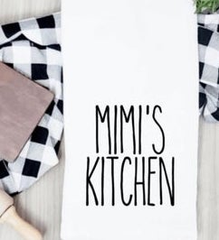 Kitchen towel that says Mimi's Kitchen in Rae Dunn font