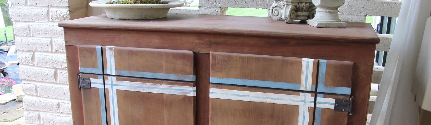 Super Closeup of a made over old wood cabinet showing just the top part