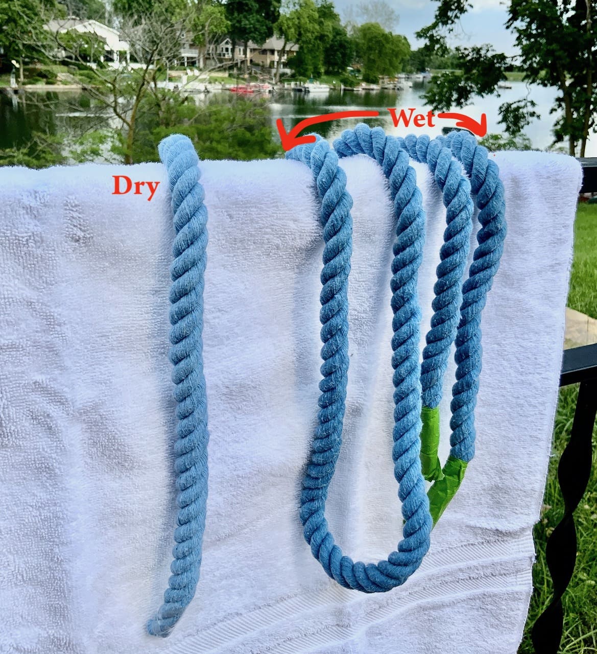 a length of dry dyed rope is shown next to several wet lengths of the dyed rope on a towel hung over a fence