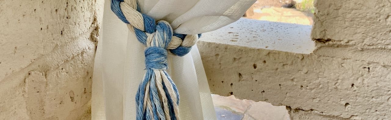 Closeup showing tassel suspended from the twisted rope