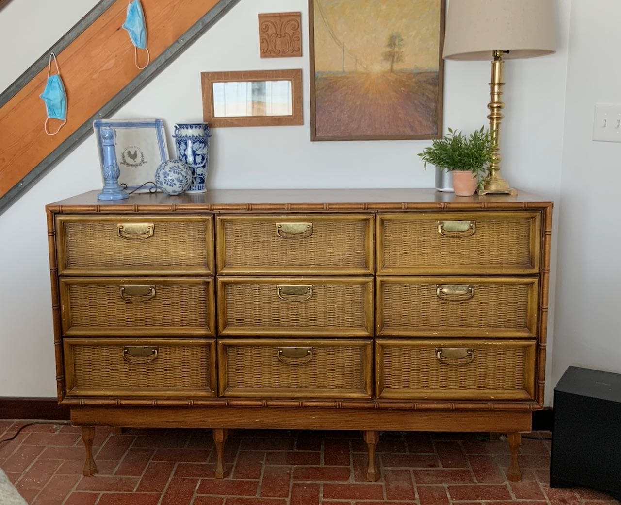 Before image of a sad golden brown faux wicker, faux bamboo chest