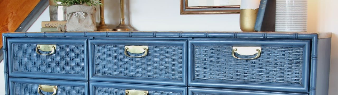 Title image of the top row of drawers painted bleu, glazed and with shiny bras drawer pulls