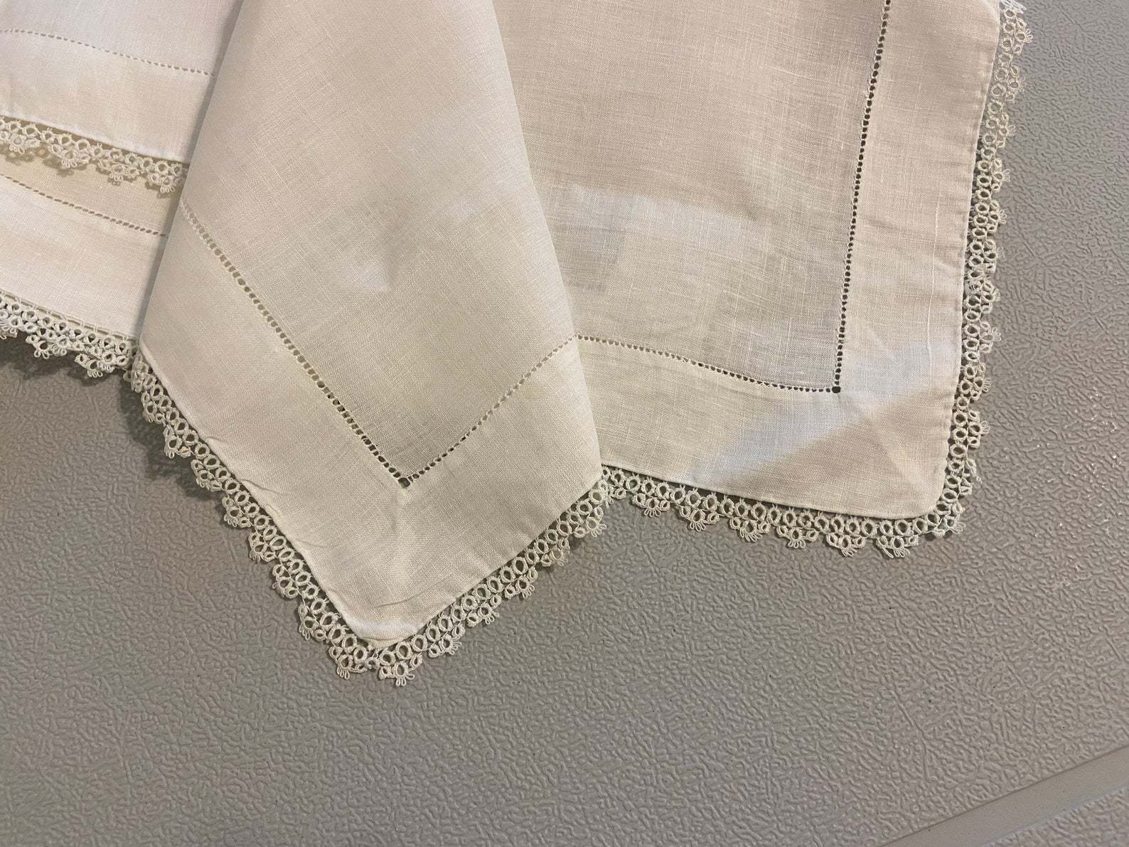 Vintage linen table square with beautiful hemstitching and a tatting edge
