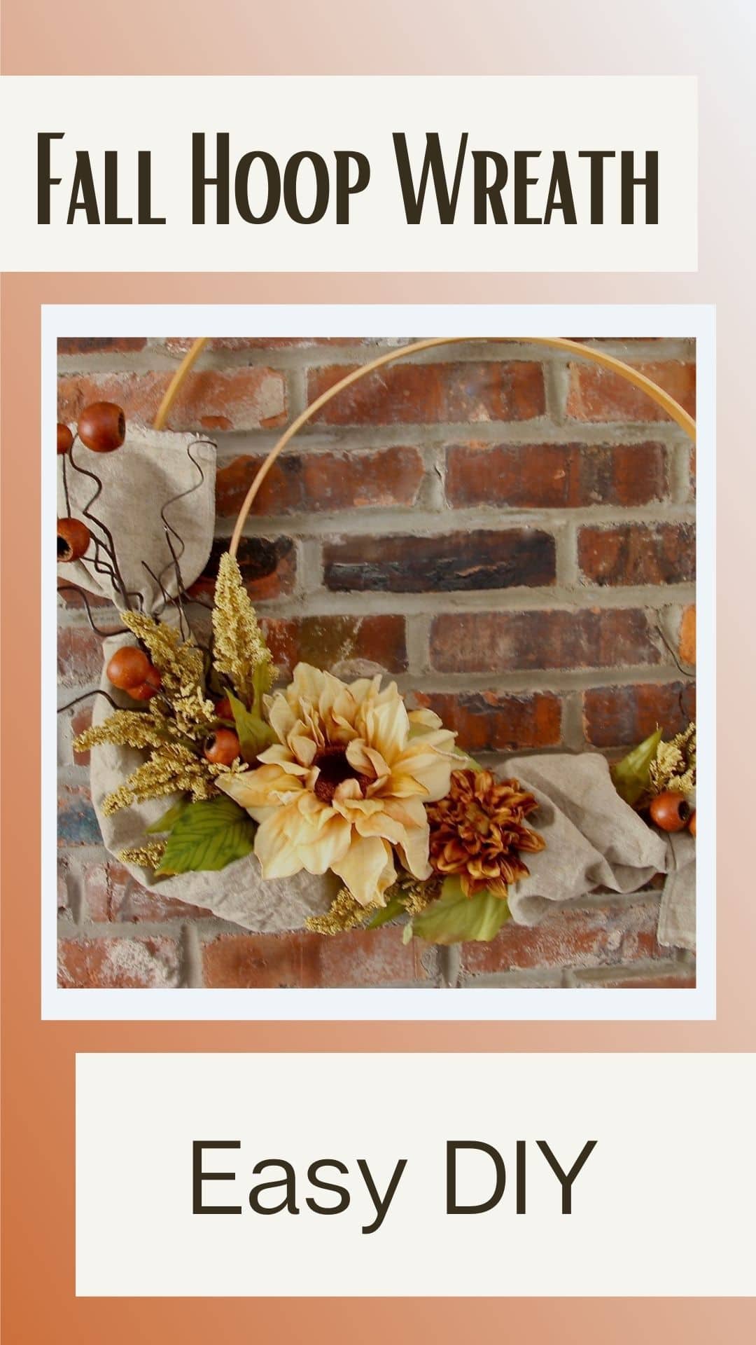 Pinterest Pin showing the finished double wood hoop wreath on a brick wall