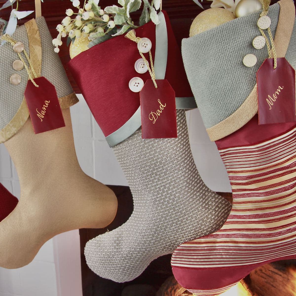 Close image of three burgundy and seafom christmas stockings