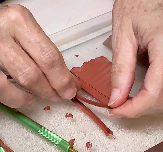 hands separating the slices and stacking them in a bundle