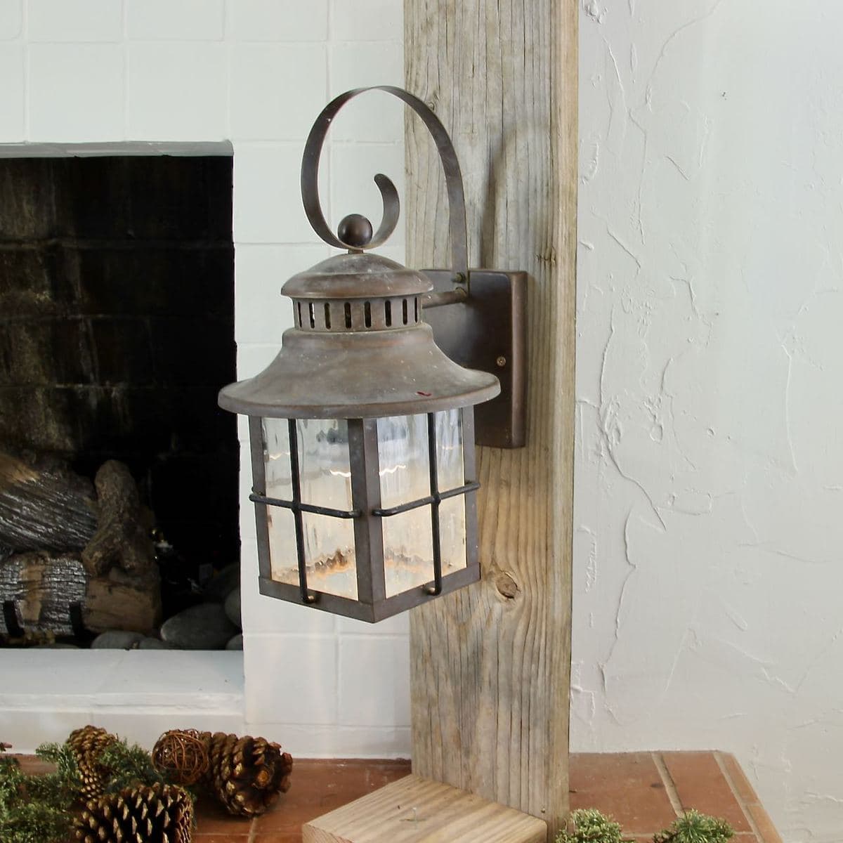 planks standing upright with a vintage lantern attached
