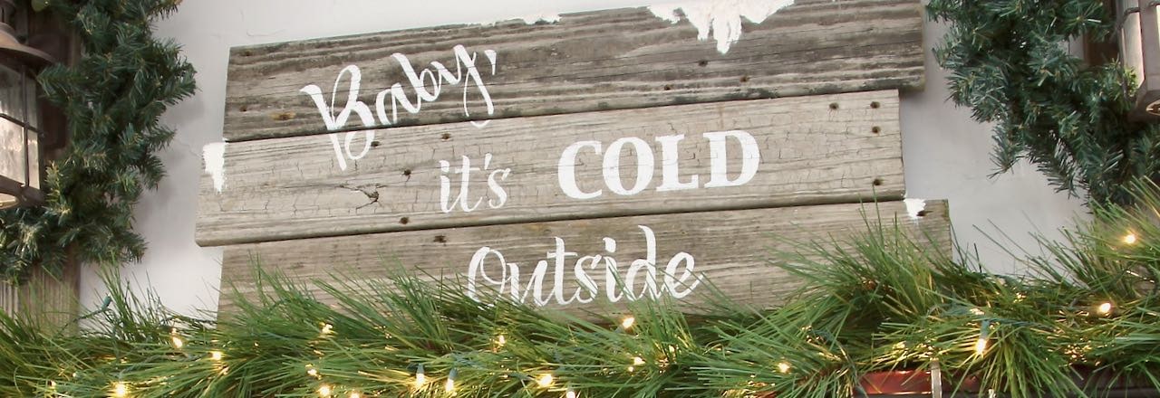 Title image closeup of reclaimed wood sign reading "Babny it's Cold ouside"