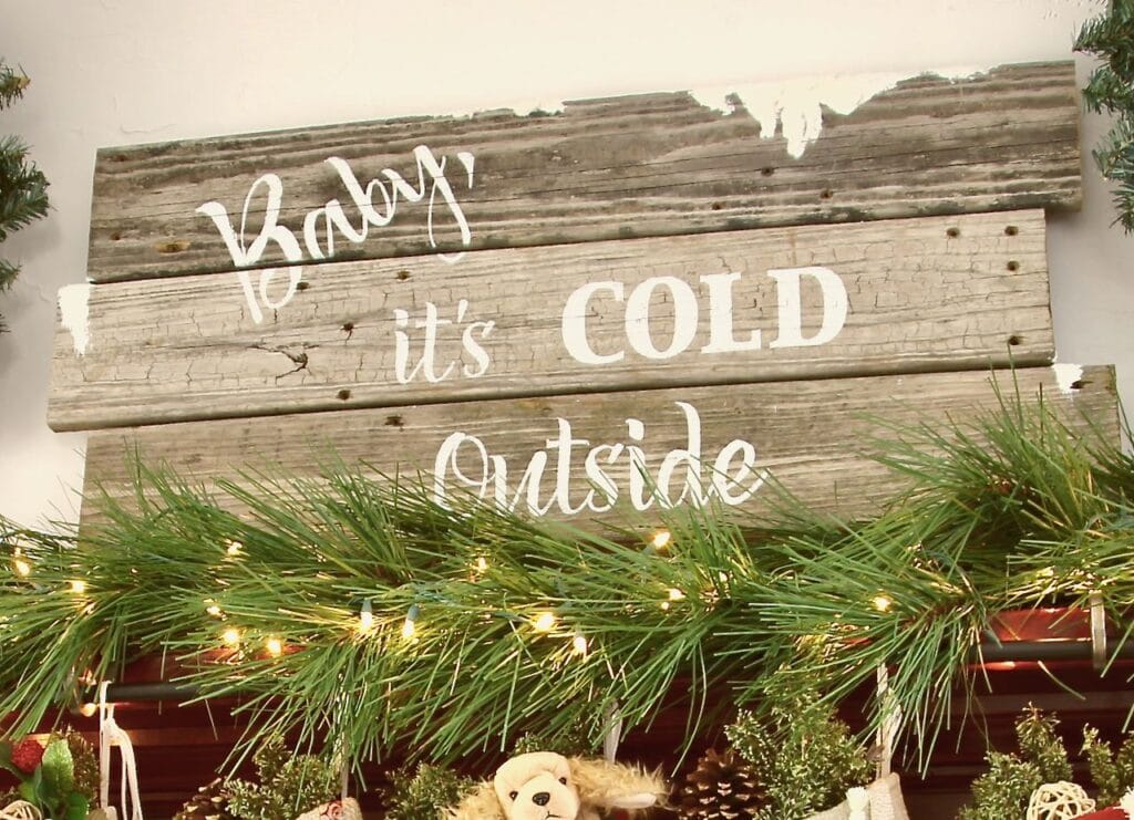 closeup of "Baby it's cold outside wood sign