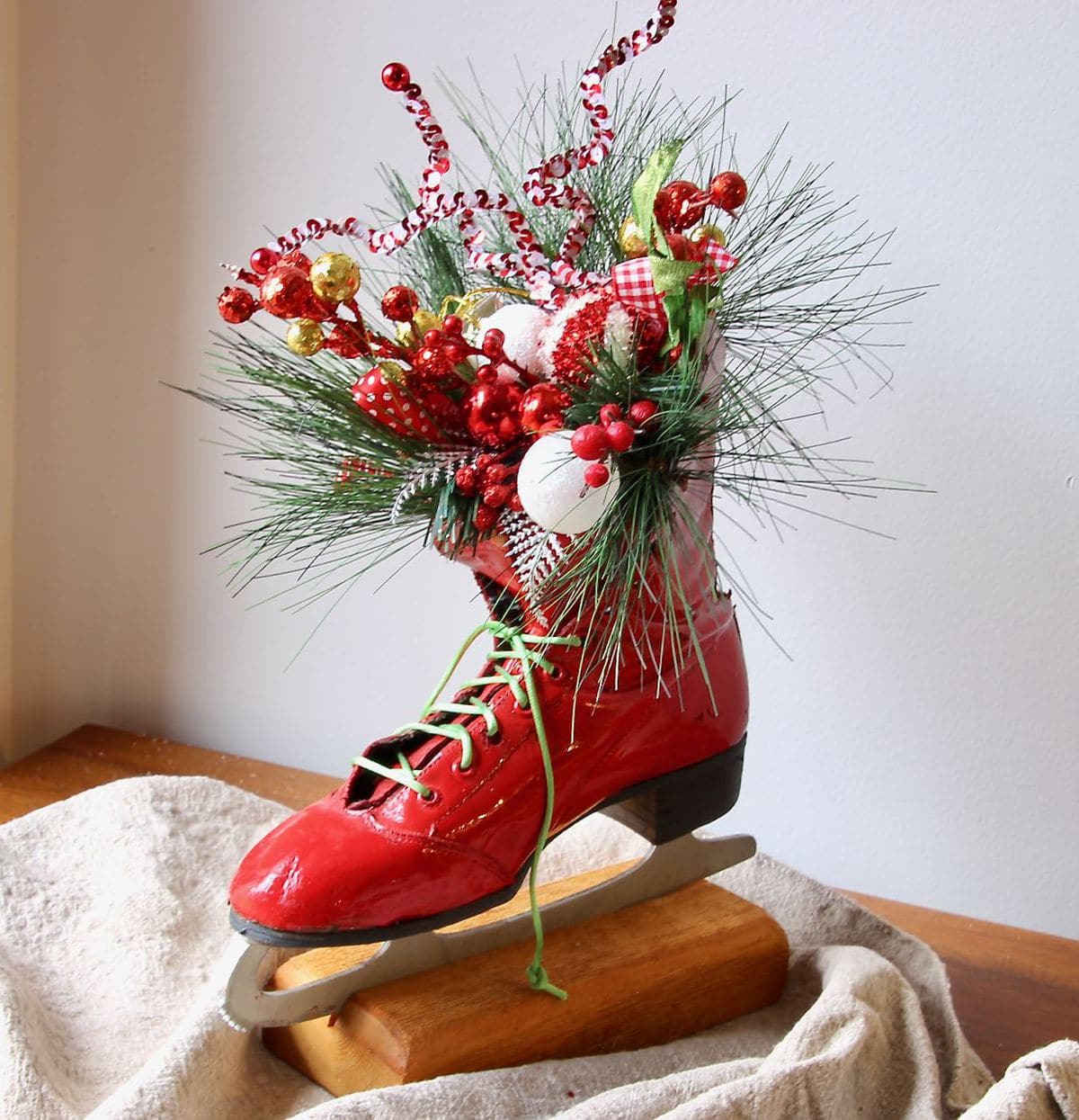 Glossy red skate with green lace and candy cane inspired fillers