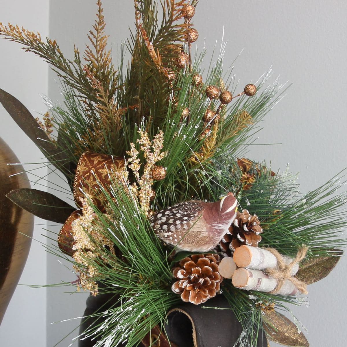 closeup of the greenery and accents spilling out of the top of the boot