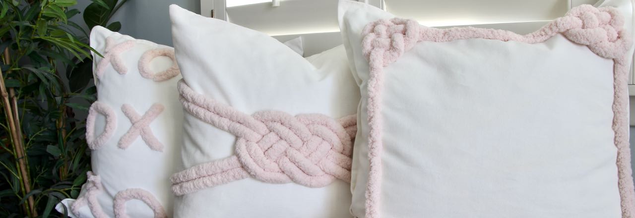 Closeup of Three Macrame-Inspired Valentine's Day Pillows