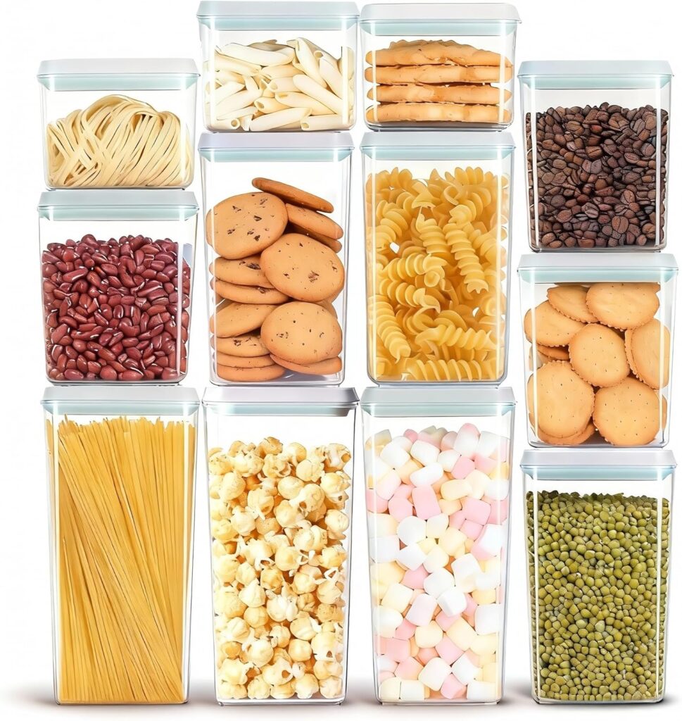 A set of clear, rectangular containers filled with pasta, cookies, crackers, beans, popcorn, marshmallows, coffee beans, and green legumes—perfect for organizing any Walk In Pantry—are arranged neatly in three rows.