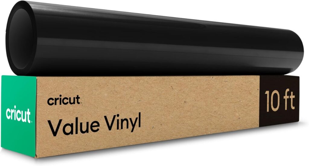 A roll of black vinyl sits on top of a brown and green Cricut box labeled "Value Vinyl, 10 ft," perfect for labeling jars or shelves in your walk in pantry.