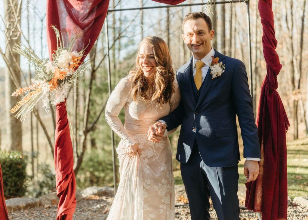 Bride and groom laughing as the ceremony is done