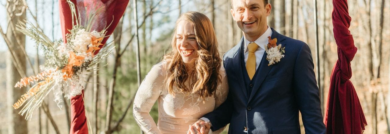 Closeup of laughing bride and groom